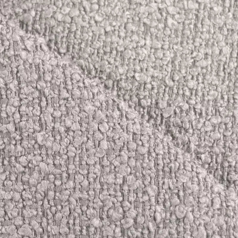 Poltrona girevole d'accento rivestita in tessuto bouclé